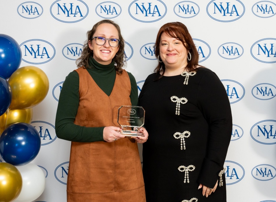 Anna Lee Dragon, Executive Director of the New York Library Association and Katie Smith. Smith receiving the Public Librarian of the Year Award in November. 
