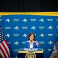 NY Governor Kathy Hochul talking at a podium. 