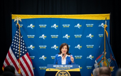 NY Governor Kathy Hochul talking at a podium. 