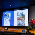 Danielle Lewis preseting a slide labeled Perception Reality with various images. 