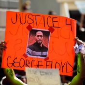 Protestor's sign featuring George Floyd. 