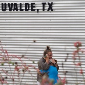 Image of parent with child in Uvalde, Texas. 