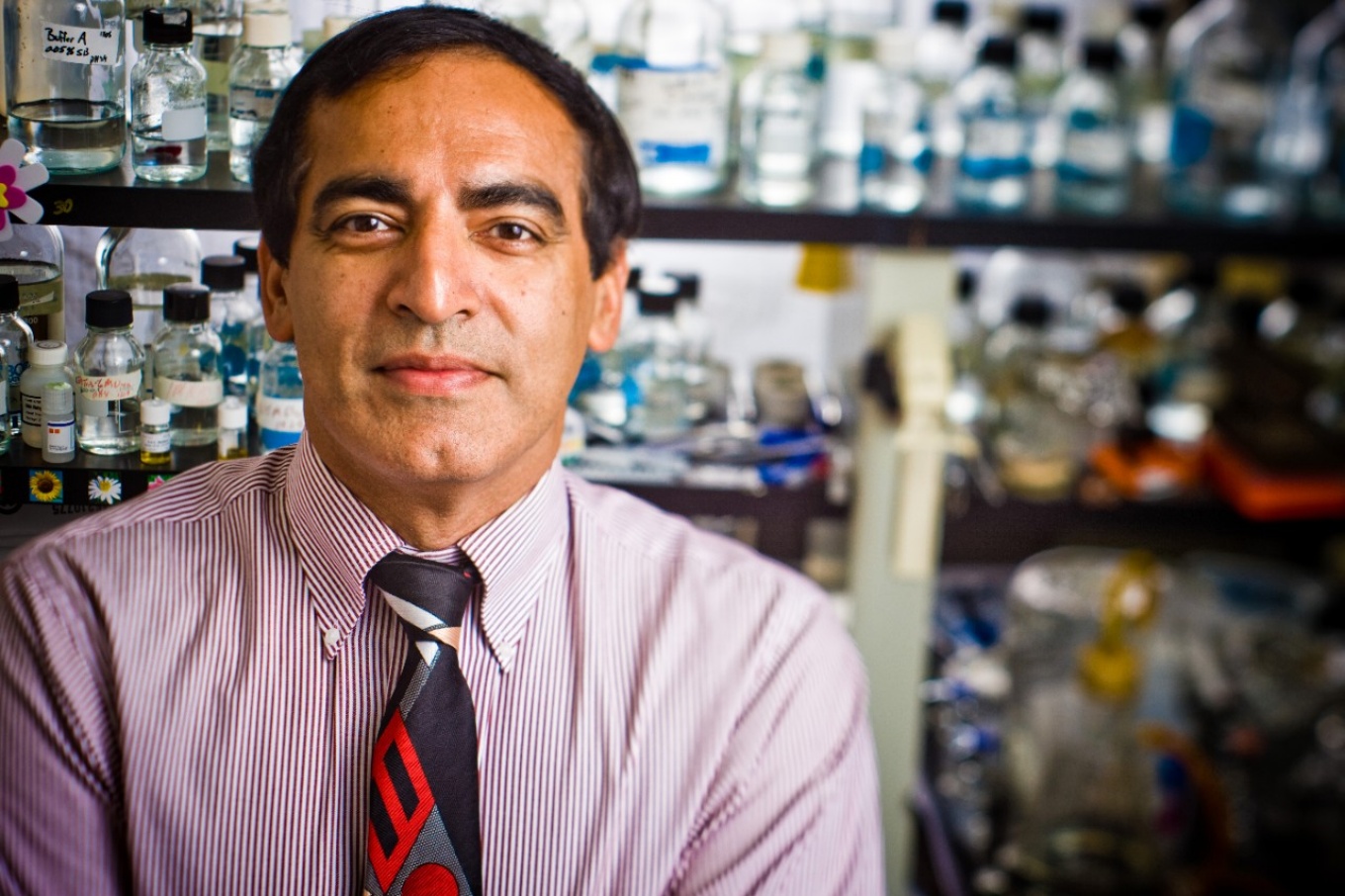 Sanjay Sethi with lab in background.