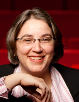 Stephanie Vander Well sits alone in a theater. 