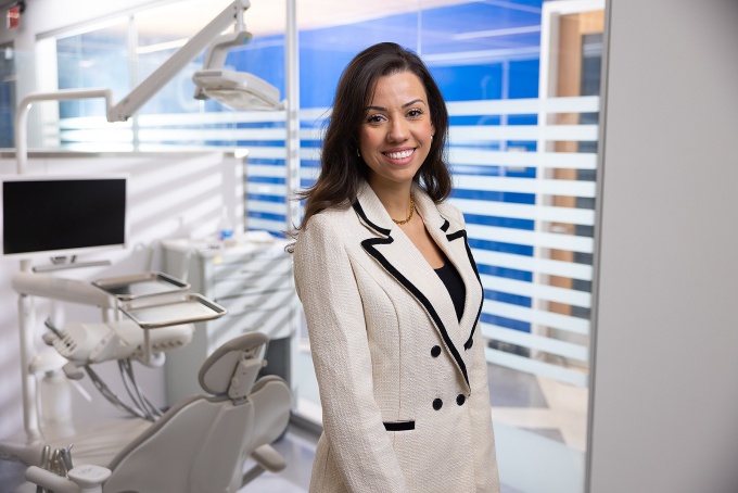 Nathalia P. Andrade stands in a dental lab. 