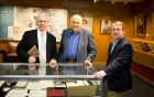 Photo of Michael Basinski, Jonathan Reichert and James Maynard with Victor Reichert's rare collection of Robert Frost materials. 