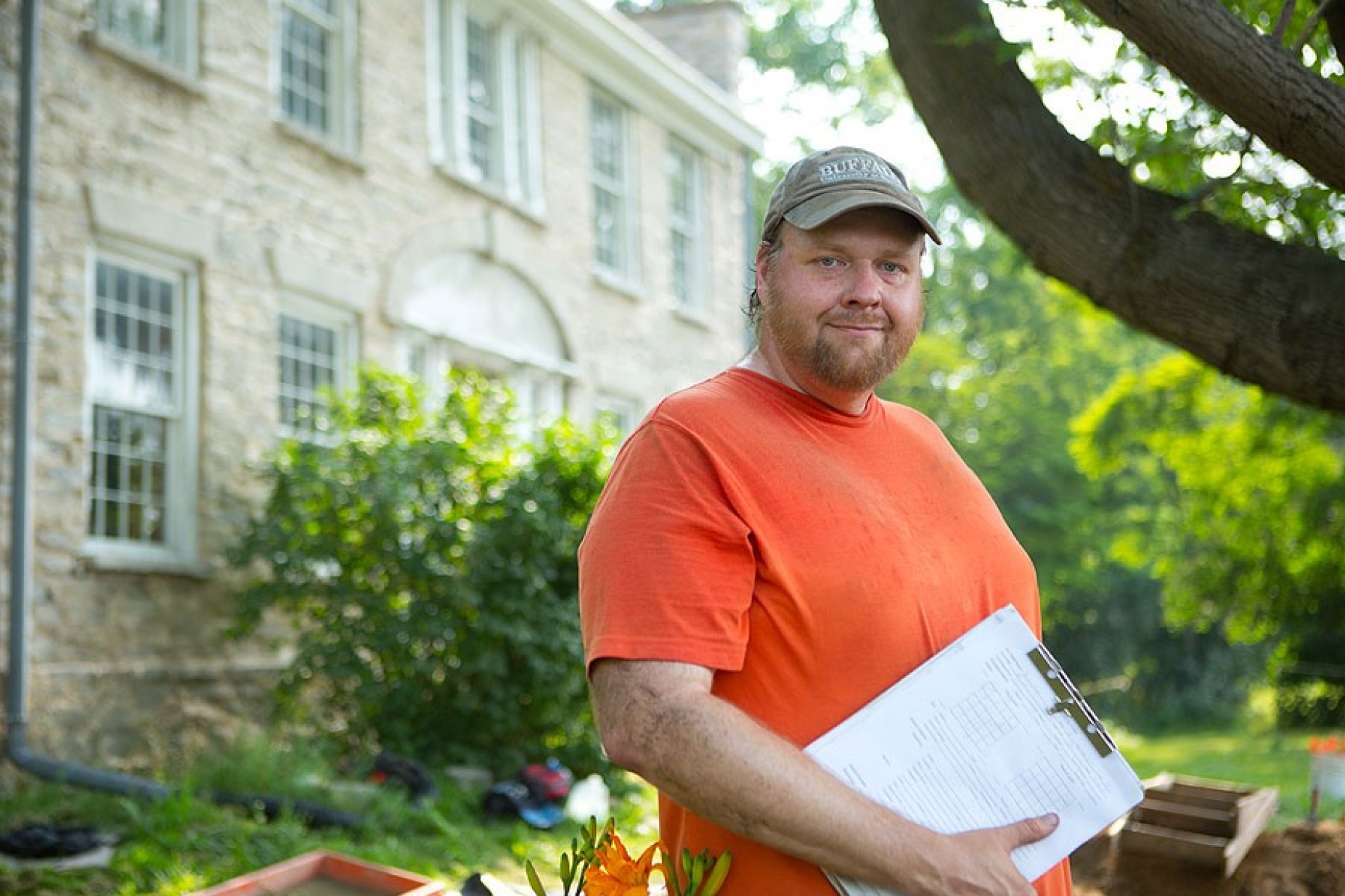 Ryan Austin standing in front of Hull House. 