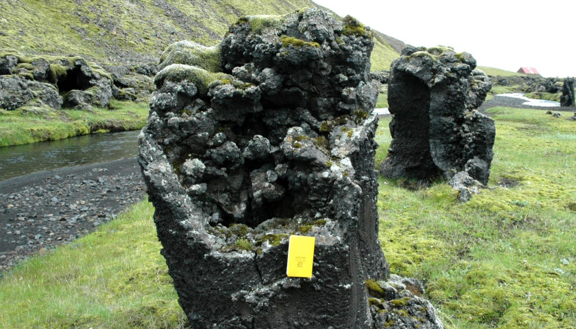 A dark stony pillar that is hollow in the center. 