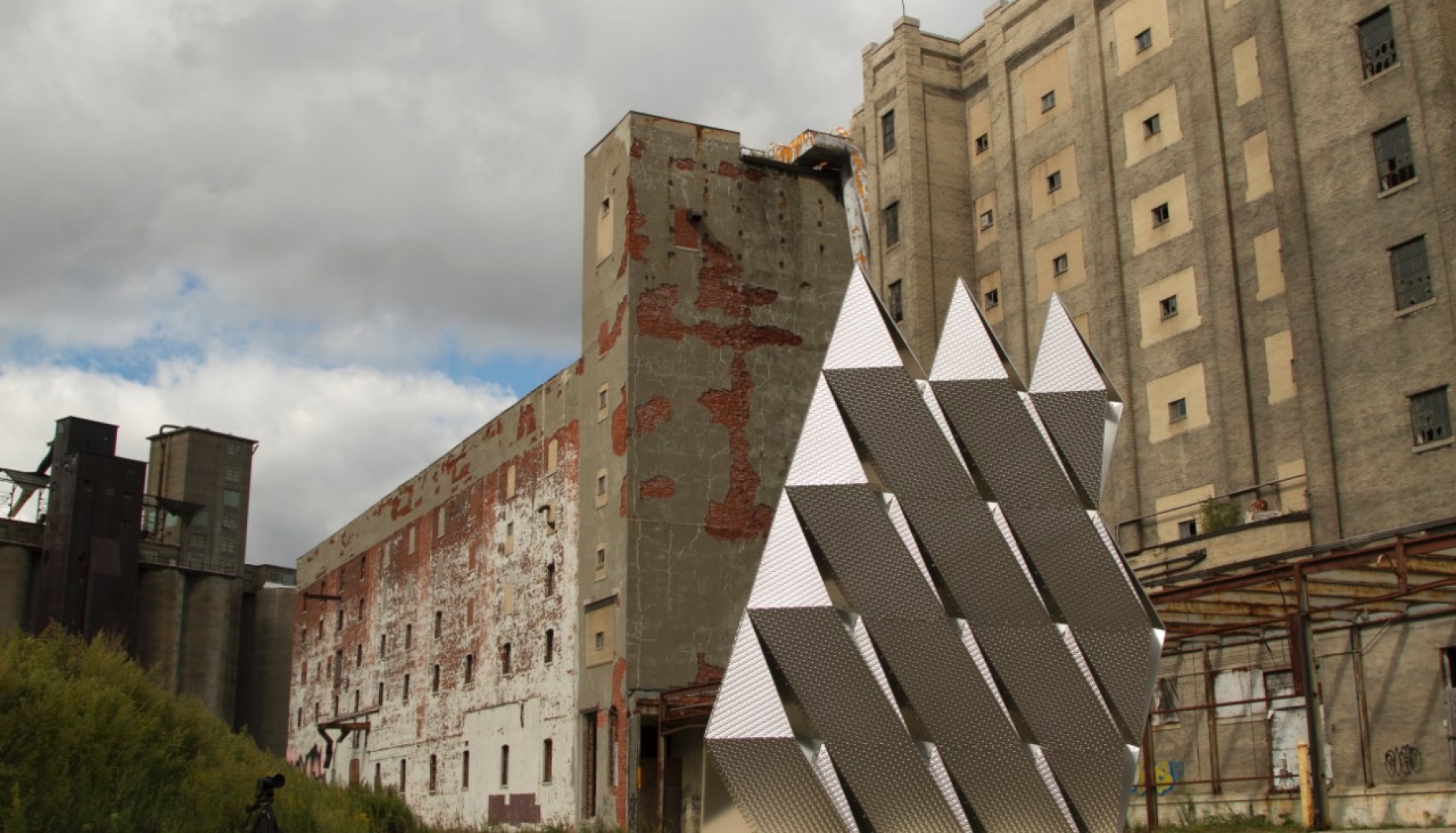 A wall made from many pieces of folded steel. 