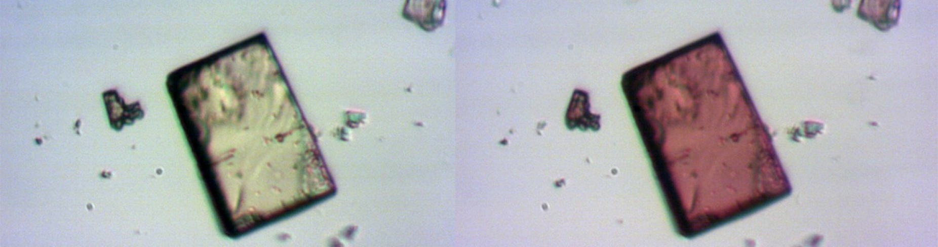 A clear, square crystal next to an image of the same crystal, now red.