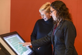 Norma Nowak and Sandra Small take a look at the interactive kiosk. 