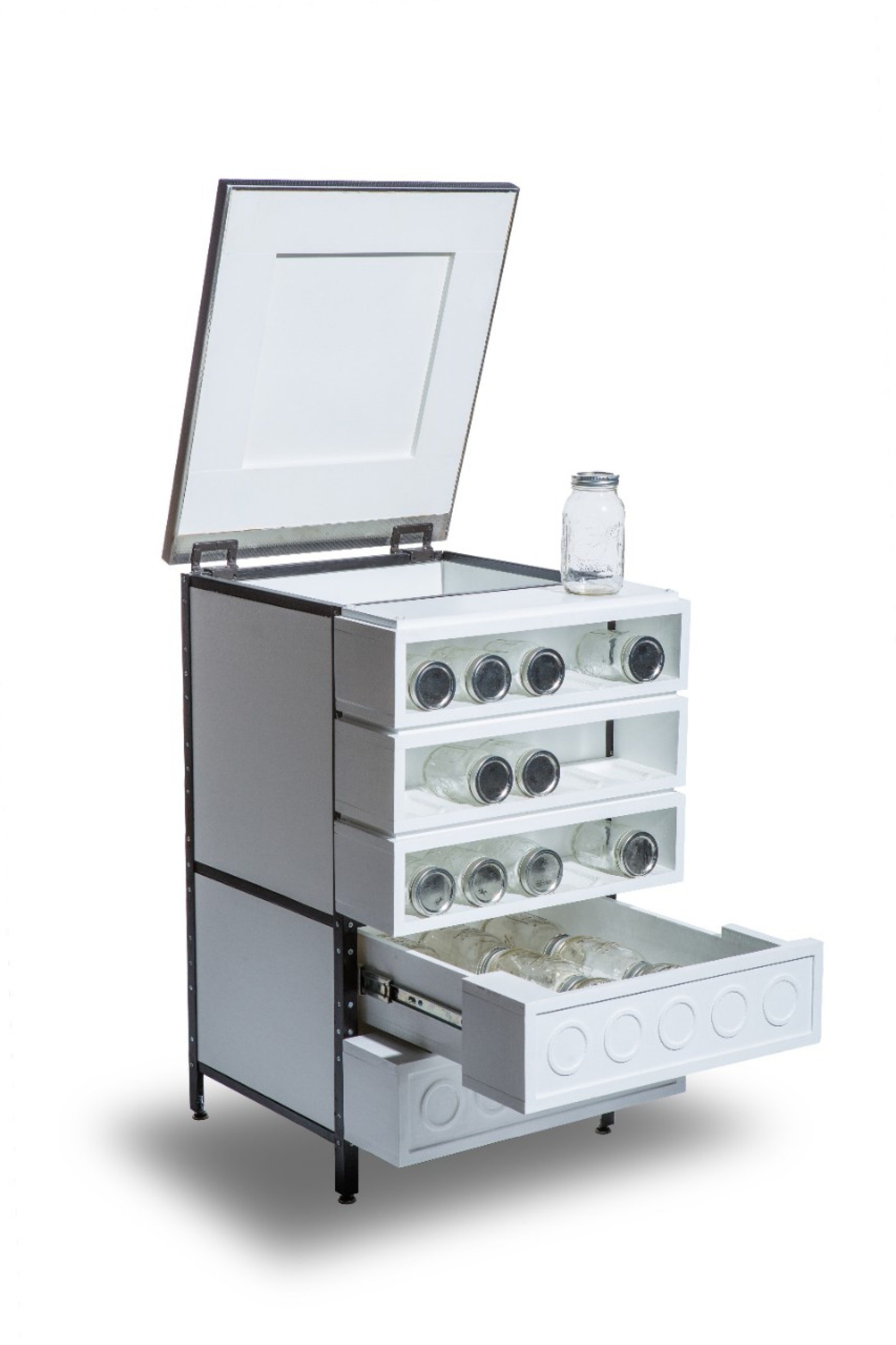 A modern-looking cabinet where mason jars are stored horizontally in open, narrow shelves. 