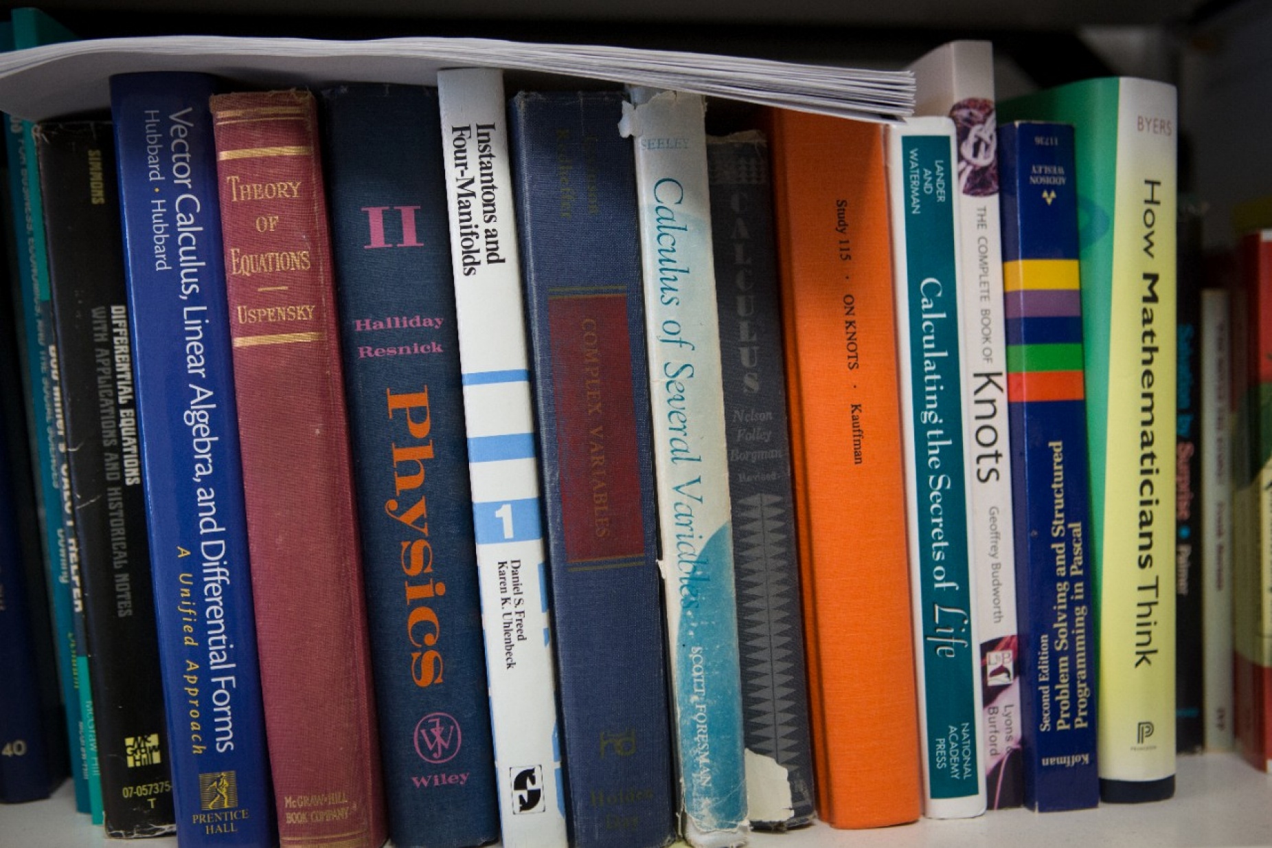 A bookshelf featuring titles on math and science.