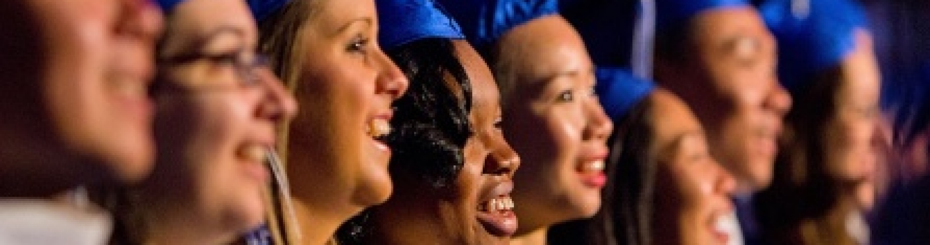 Students wearing caps and gowns. 