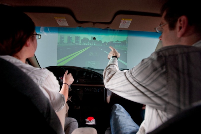 Researcher in the driving simulator. 