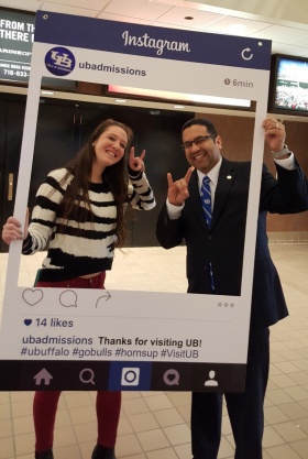 Zoom image: UB freshman Libby Walker and Jose Aviles, associate vice provost and director of admissions, at a UB Admissions informational event in New York City in spring 2016. 