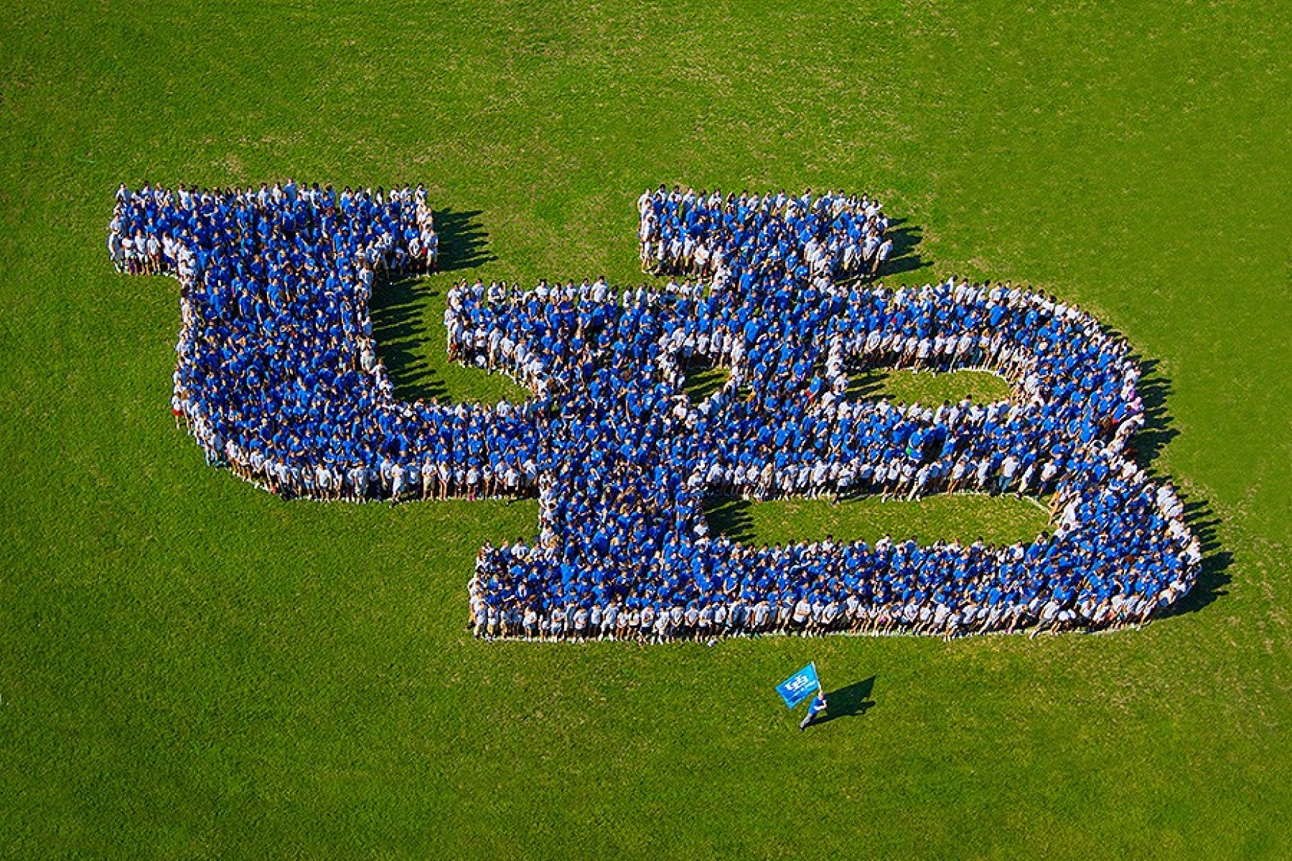 Students create a living UB logo.
