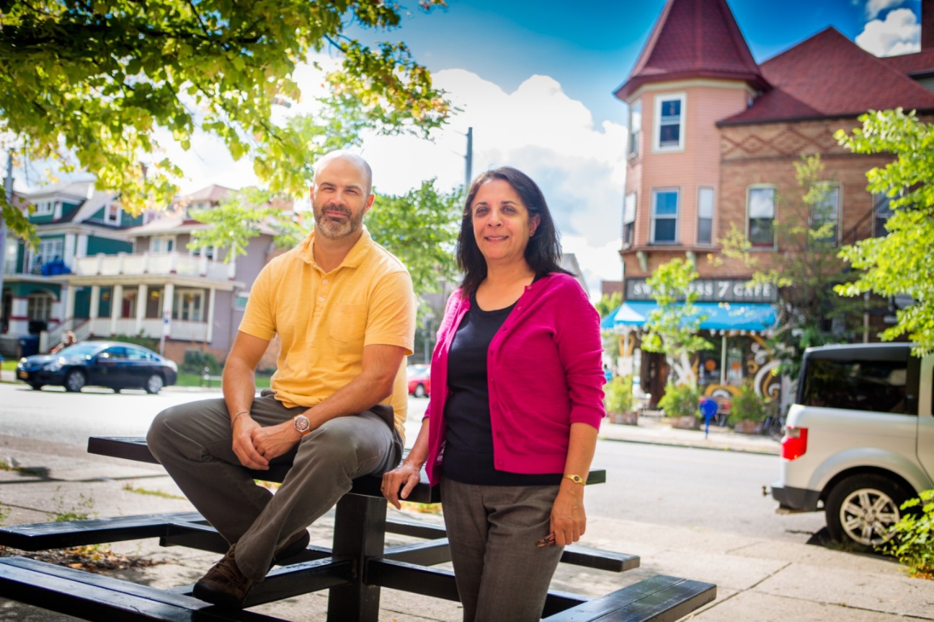 University at Buffalo geography professor Sharmistha Bagchi-Sen and SUNY Buffalo State assistant professor of geography and planning Jason Knight outside on a street.