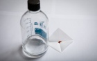 A clear solution and reddish crystals. 