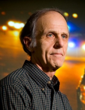 Environmental portrait of John Violanti. 