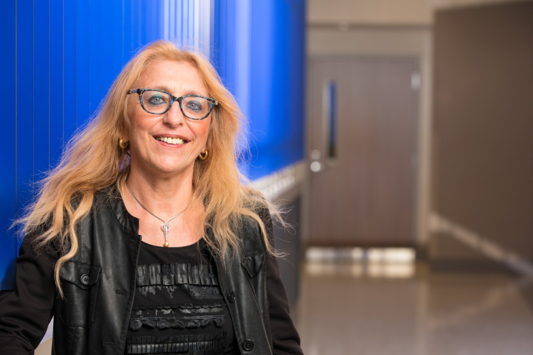 Bianca Weinstock-Guttman, portrait shot in hallway (Conventus). 