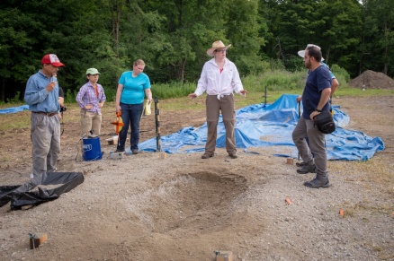 Zoom image: Alison Graettinger (center, in white shirt) led post-blast activities like photography of craters and measurements of ejecta. Graettinger is an assistant professor of geosciences at the University of Missouri-Kansas City who previously conducted postdoctoral research at UB. Credit: Meredith Forrest Kulwicki 