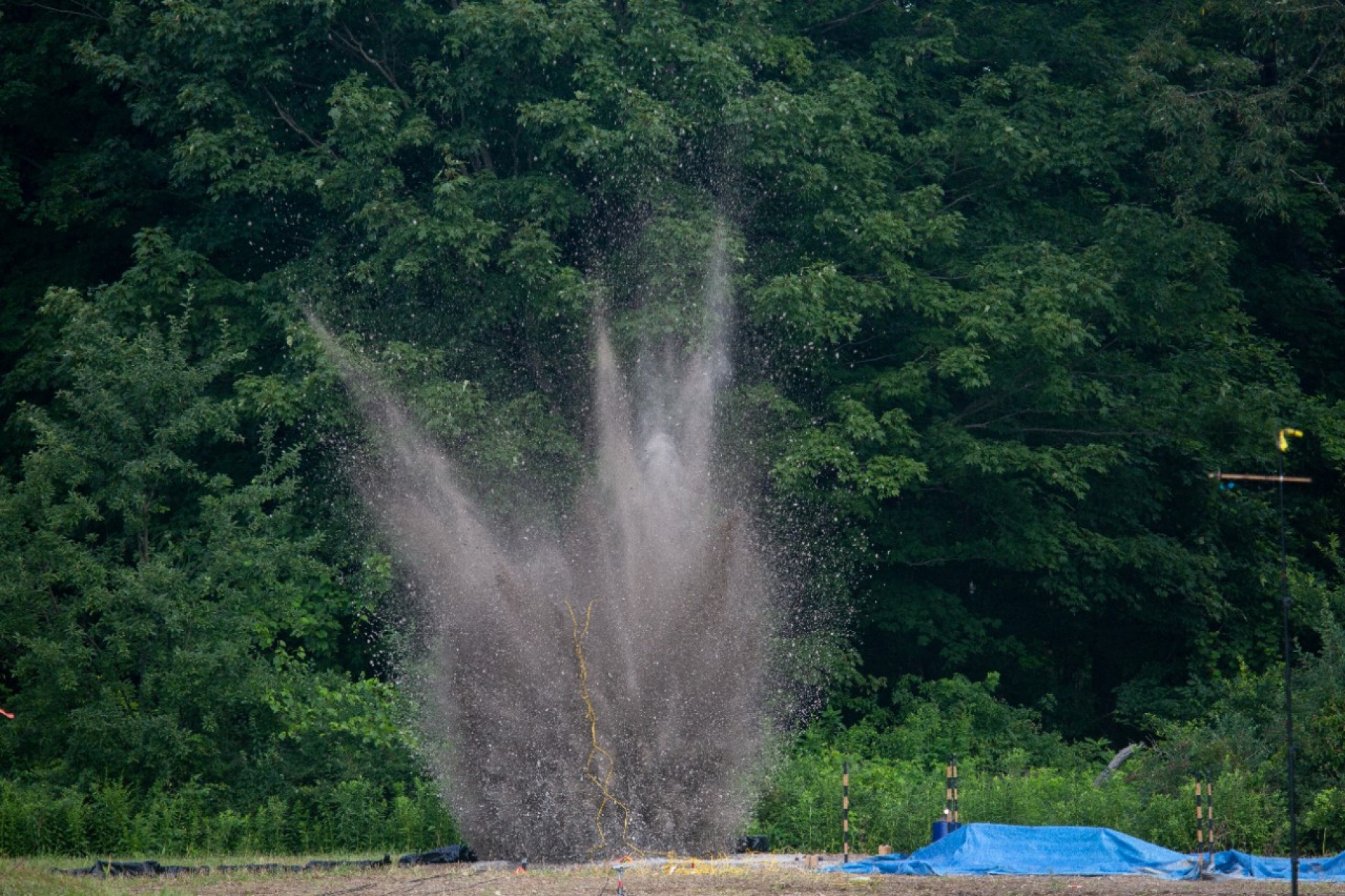Zoom image: Debris flies during one of the workshop's four explosive tests. Credit: Meredith Forrest Kulwicki 