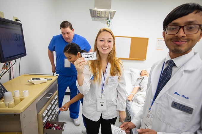 Group A members (from left) Noah Bourne, Samantha Manahan, Allyson Raditic and Ebne Rafi learn they had "saved" Patient X. 