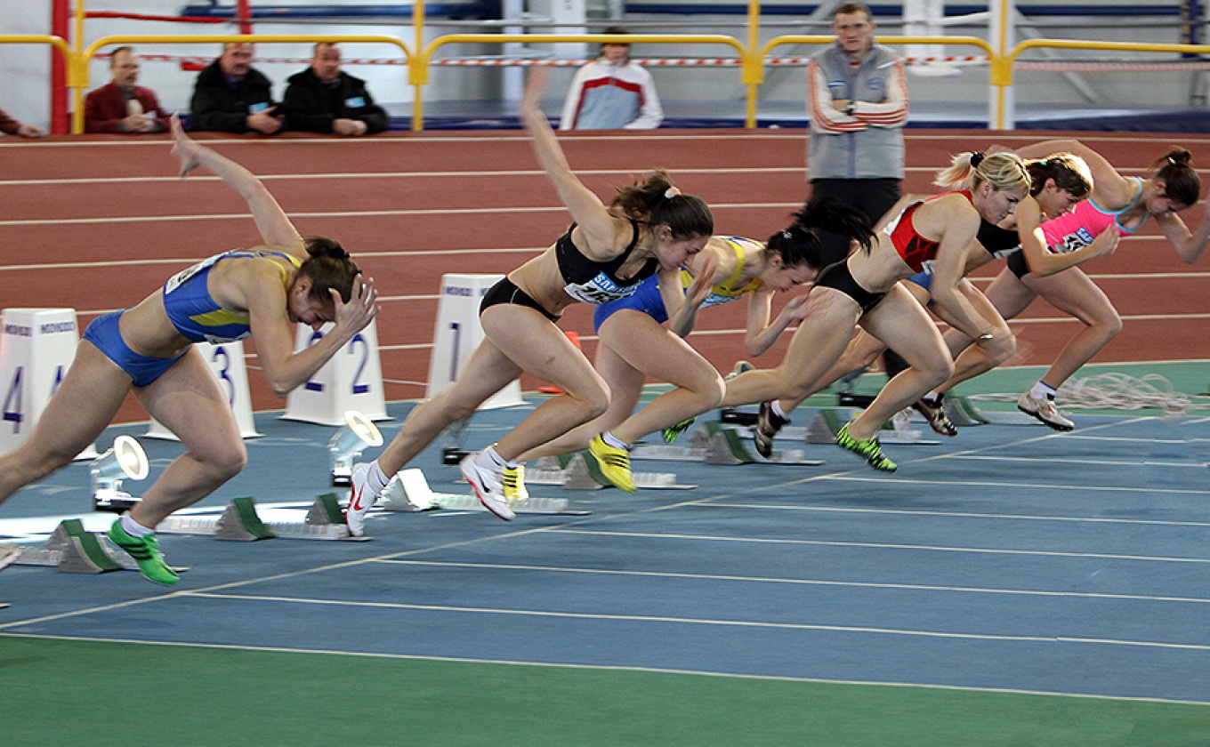 Female athletes on the start of the 60 meters dash during the Ukainian Track and Field Championships on February 17, 2012 in Sumy, Ukraine.