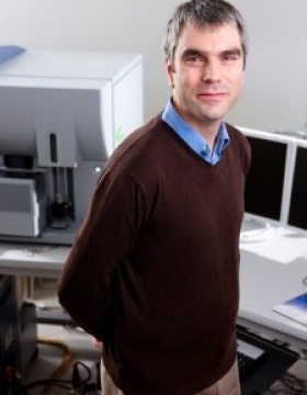 Fraser sim standing in office. 