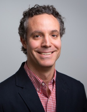 Head shot of Adam Wilson. 