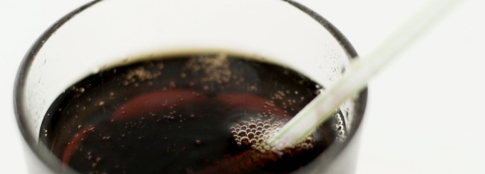 Glass of pop with straw. 