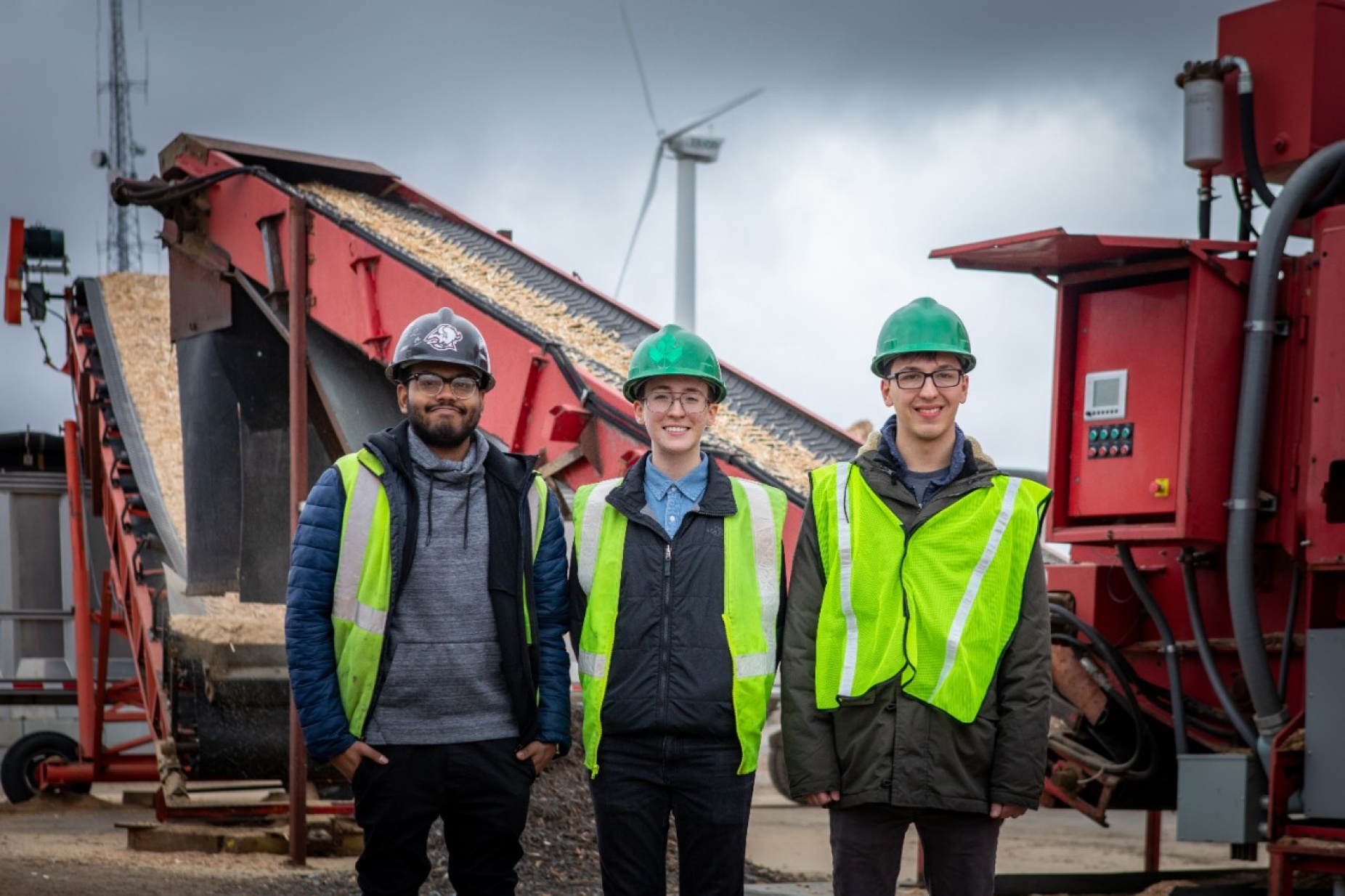 Zoom image: Left to right: Through a new UB class, UB students Dan Moses, Sean O&rsquo;Neill and Todd Glosser are partnering with Triad Recycling and Energy to help the company reduce its carbon footprint. Credit: Douglas Levere / University at Buffalo 