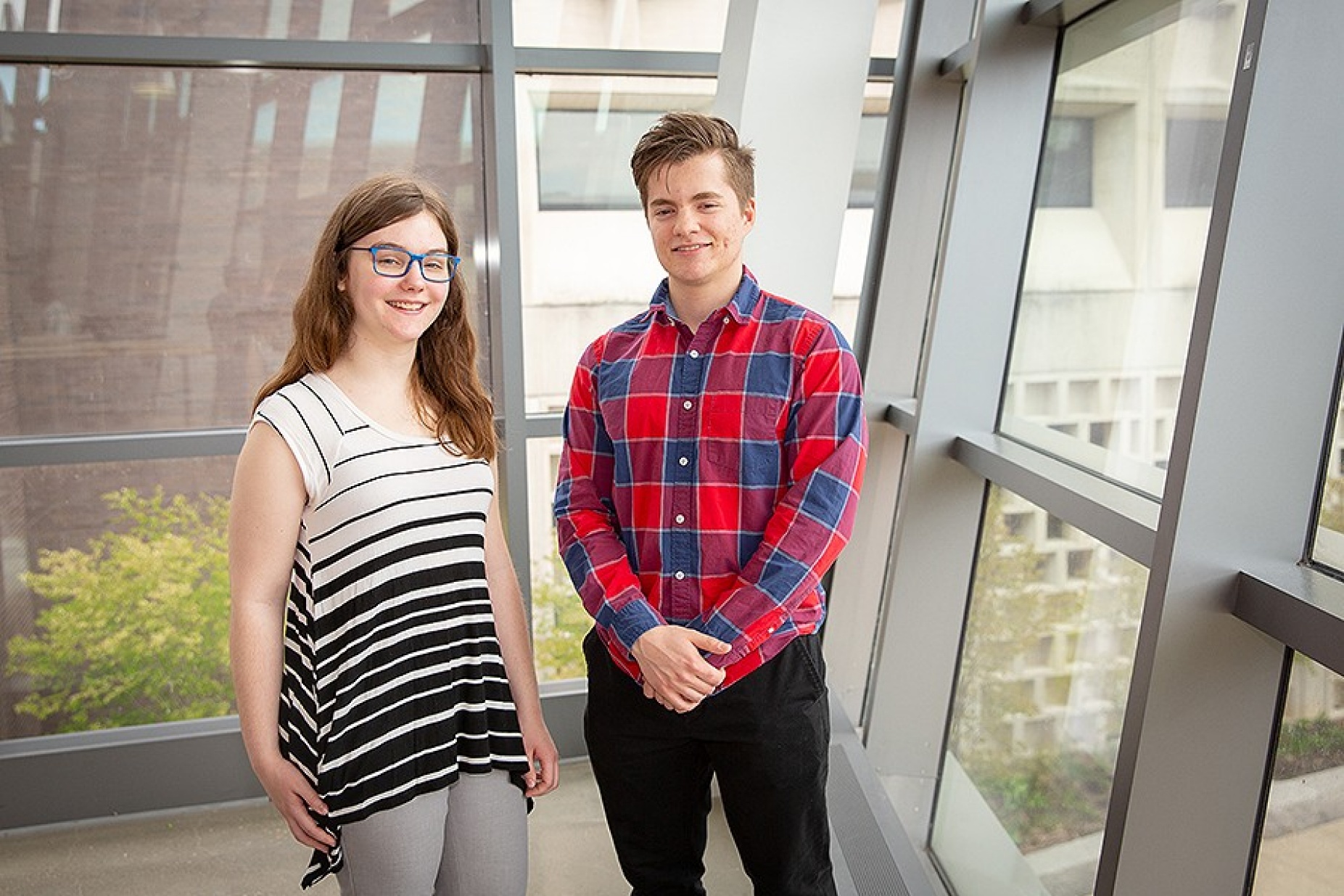 Hannah Seppala (left) and Dennis Fedorishin pose together in Davis Hall. 