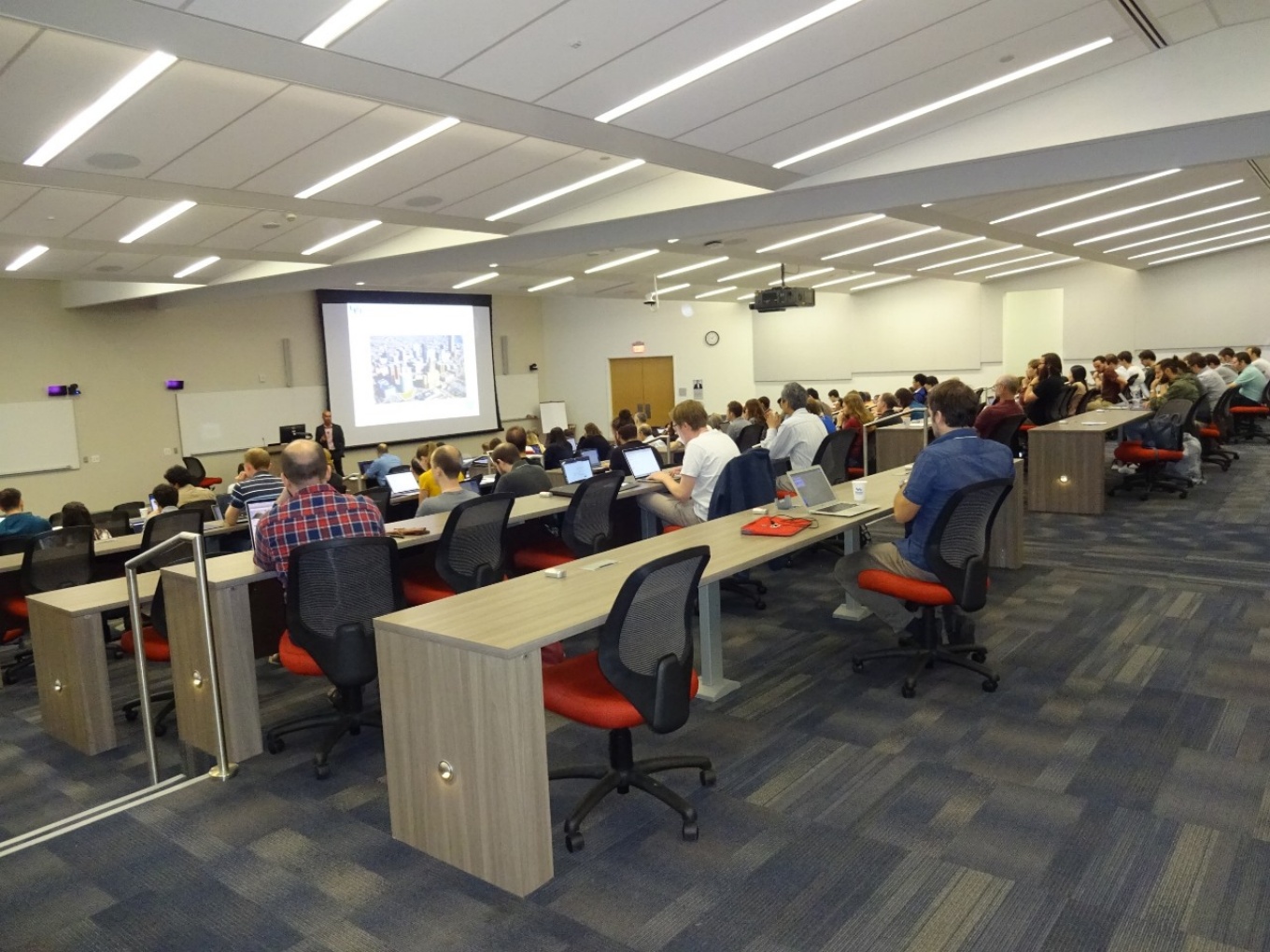 Zoom image: The QCD@LHC conference hosted by UB physicists opened Monday morning on UB&rsquo;s downtown campus in the Jacobs School of Medicine and Biomedical Sciences building. Credit: Charlotte Hsu 