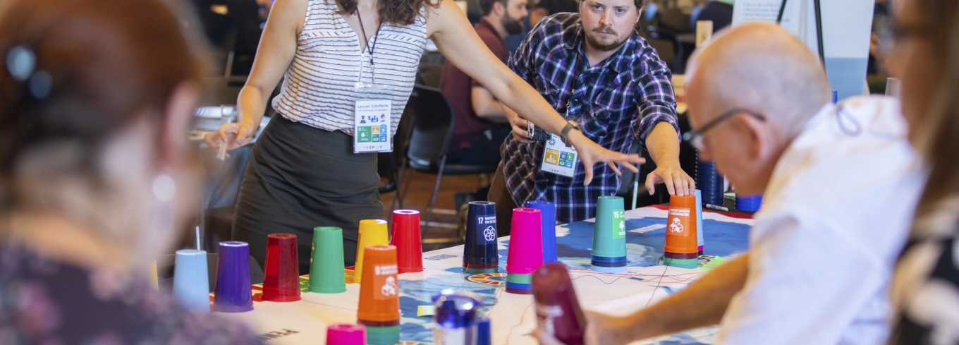 Workshop attendees participate in a mapping activity designed to demonstrate the regional impacts of proposed research ideas, and how the research would further goals related to resilience and sustainability. Credit: Douglas Levere / University at Buffalo. 