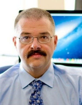 Portrait of UB researcher Dave Hostler in his office. 