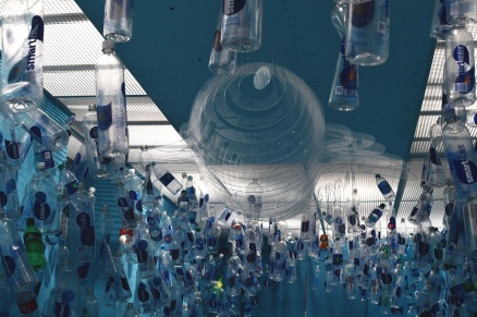 Zoom image: One-thousand plastic beverage containers &mdash; and counting &mdash; dangle from the ceiling of the last room of &ldquo;Ocean Cube.&rdquo; Credit: Randy Fernando 