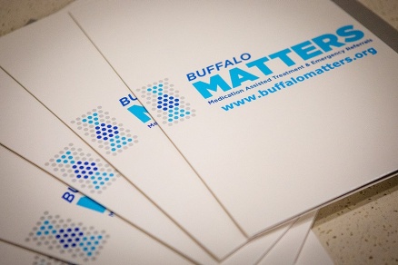 Zoom image: Folders with information on the Buffalo MATTERS program were available at a UB media briefing about the program's statewide rollout. Credit: Douglas Levere, University at Buffalo 