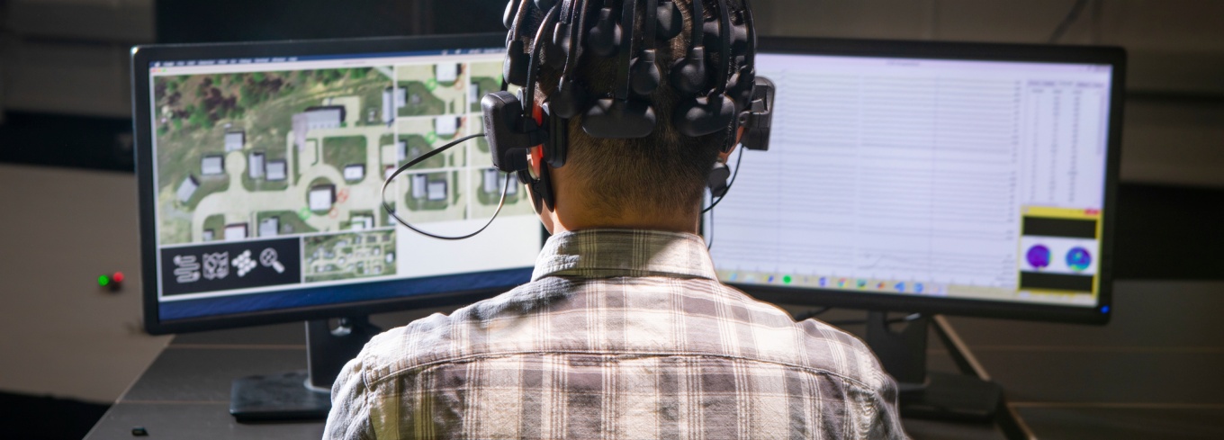 Students wears a device that measure the electrical activity in his brain while he plays video games during experiments for the project. 