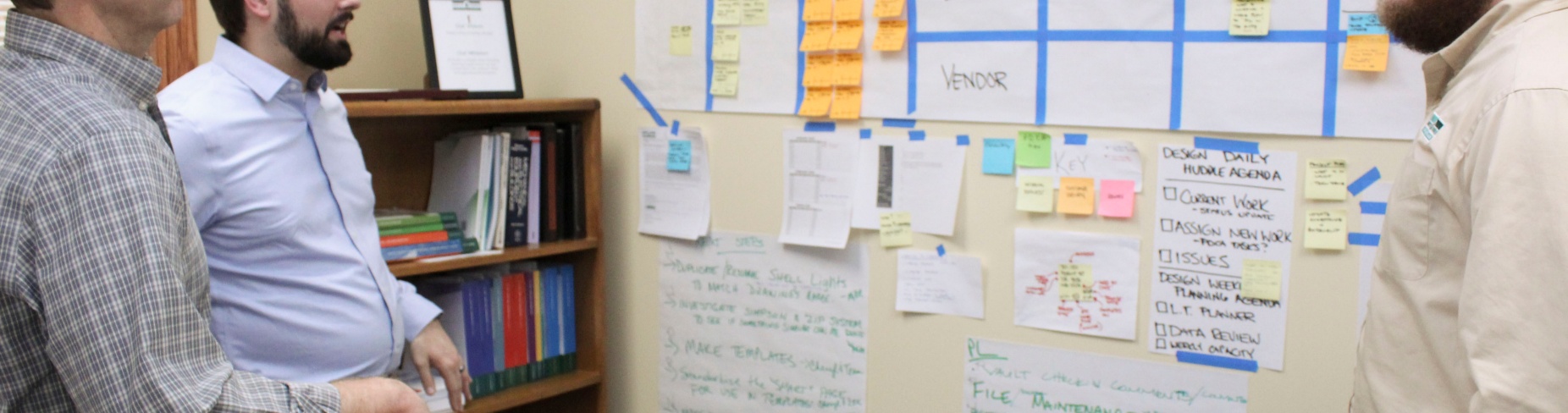 From left: Mike Seeley, Chris Kozlowski and Kevin Moore discuss current projects of North Forest Office Space&rsquo;s design department and their progress. 