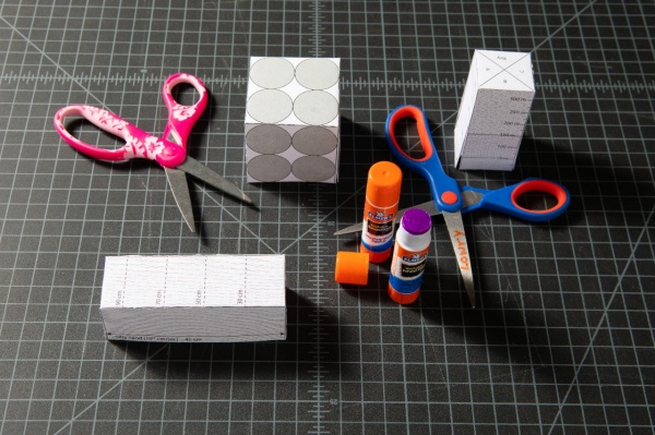 Zoom image: Cut, fold, glue! University at Buffalo hydrology researcher Chris Lowry hopes that constructing paper aquifers will help students understand concepts related to groundwater. Credit: Douglas Levere / University at Buffalo 