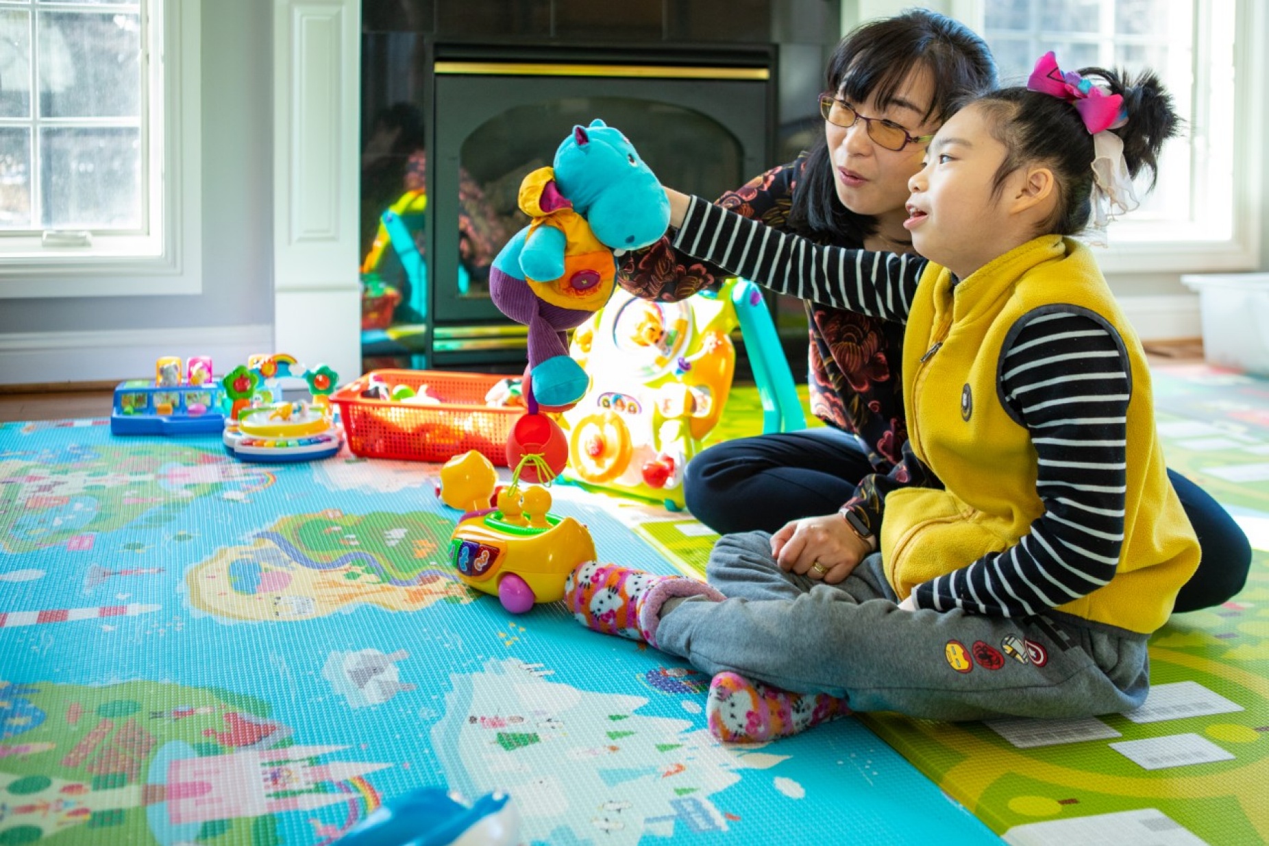 Zoom image: Soo-Kyung Lee, left, with her daughter, Yuna. Credit: Douglas Levere / University at Buffalo. View and download additional photos. 