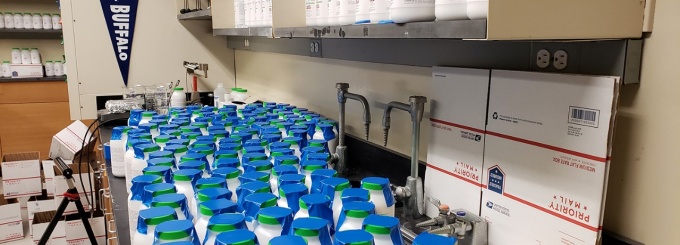 Zoom image: Bottles of alum &mdash; the crystal-growing material of choice &mdash; pictured in the University at Buffalo chemistry department in 2018. Credit: Charlotte Hsu / University at Buffalo 