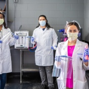 UB students Joycelyn Moss, Philip Sales and Shaina Chechang hold PPE materials. 