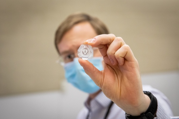 Zoom image: David Heppner, Jere Solo Assistant Professor of Medicinal Chemistry at UB, was a first-time judge. Credit: Meredith Forrest Kulwicki. Additional photos of the crystal contest judging are available for download. 