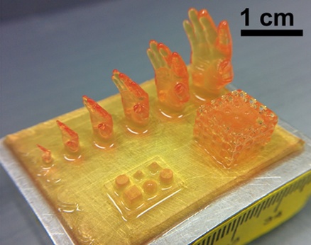 Zoom image: Researchers made a series of small scale models of the 3D-printed hand, as well as other figures. Credit: University at Buffalo. 
