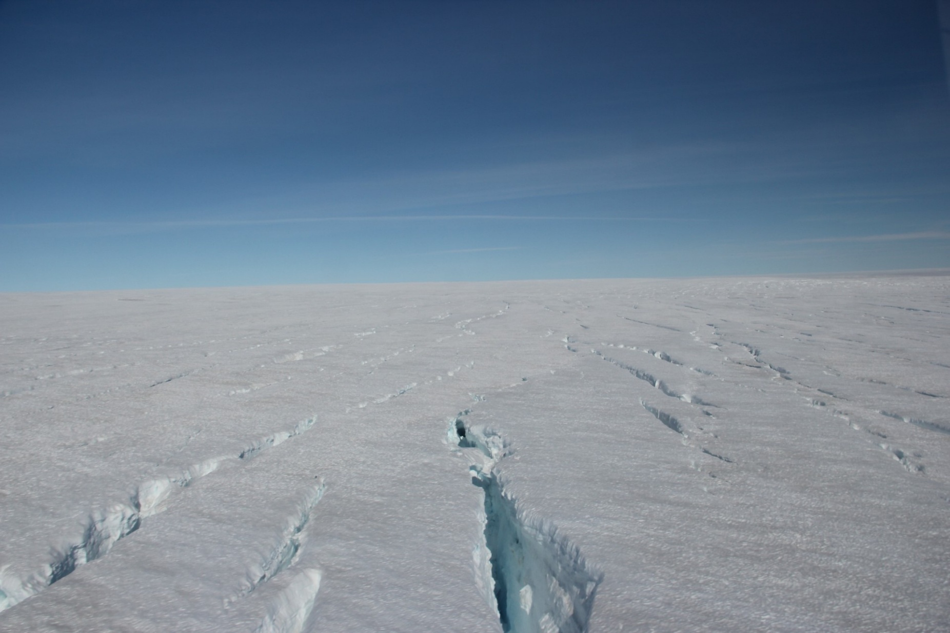 Zoom image: A view of a crevasse field on the Greenland Ice Sheet. Credit: Cl&eacute;ment Mi&egrave;ge / University of Utah 