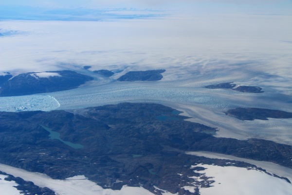 Zoom image: Helheim Glacier in southeast Greenland is visible during an Operation IceBridge flight on Sept. 11, 2016. Credit: NASA / John Sonntag 