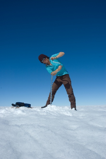 Zoom image: Kristin Poinar conducting field research in Greenland several years ago. Poinar, a faculty member and researcher in the University at Buffalo Department of Geology and RENEW Institute, will lead field expeditions to Greenland to study Helheim Glacier starting in the summer of 2022. Credit: Sarah Das / Woods Hole Oceanographic Institute 